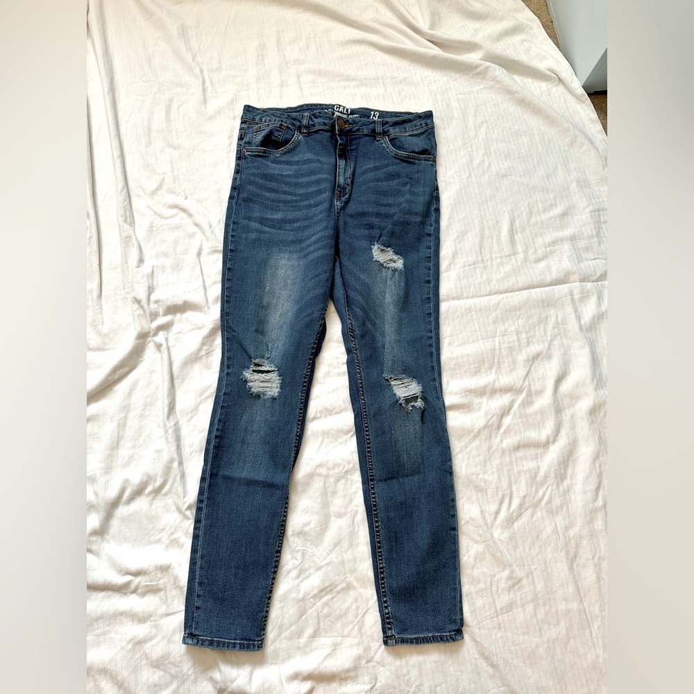 Distressed blue jeans